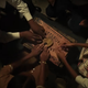 Four youngsters play with a Ouija board in Episode 3 of ‘Lovecraft Country.’